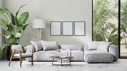 poster frame mock up in modern living room interior with gray sofa, wooden furniture and palm tropical leaves, 3d rendering