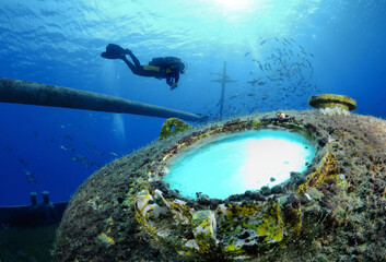 Scuba diver explores ship wreck, Grand Cayman Island