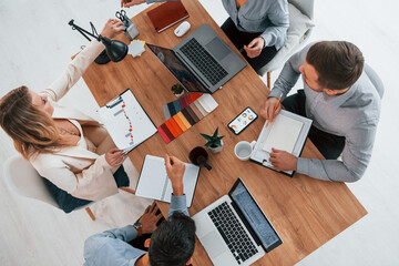 Top view. Group of business people that working on the project in the office