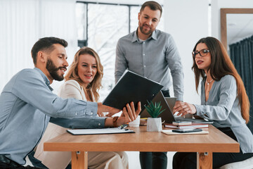 Conception of success. Group of business people that working on the project in the office