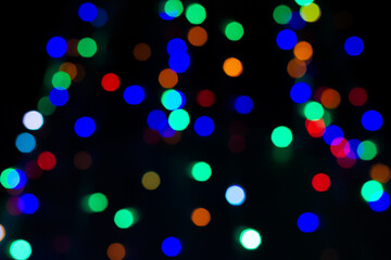 Defocused colorful bokeh glitter lights background