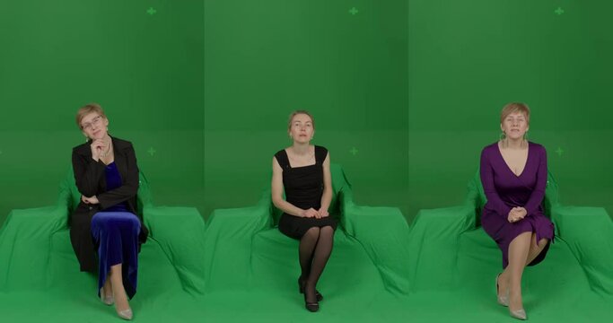 GREEN SCREEN CHROMA KEY Front view of female woman spectators wearing formal attire watching performance on stage. Crowd replication for theater, opera, ballet. Unkeyed chairs to keep shadows