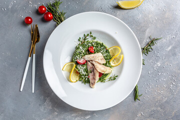 Pike perch fillet with mussels, peas, asparagus and vegetable cream sauce. Fried fish with stewed greens. Restaurant menu, dieting, cookbook recipe