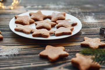 Cookies is on the plate. Christmas background with holiday decoration