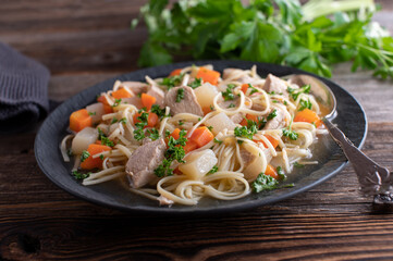Plate with chicken noodle soup