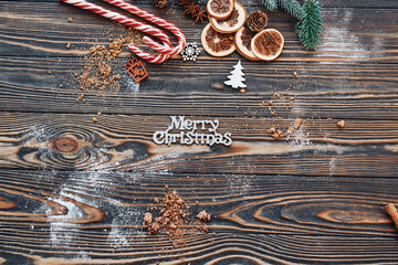 Candies and slices of oranges. Christmas background with holiday decoration