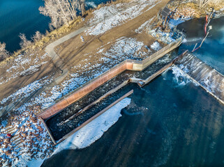 Fototapeta na wymiar fish ladder at water diversion dam - Watson Lake Dam on the Poudre River in northern Colorado, aerial view of winter scenery, wildlife management concept