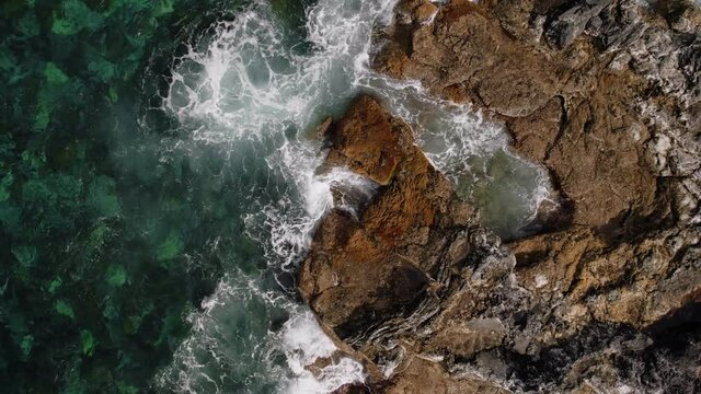 Waves breaking on Atlantic ocean shore of Azores.