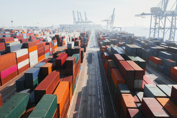 Cargo ship with containers in industrial area
