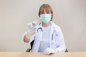 Caucasian Female Doctor Hold Covid19 Vaccine Bottle