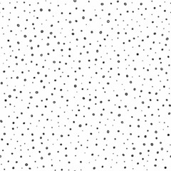 Cute seamless pattern in polka dot style. Black and white abstract print for textiles. Ink dots on a white background. Vector illustration.