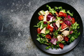 Fres vegetable salad with grilled chicken breast. Top view with copy space.