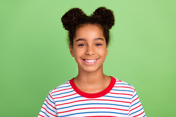 Portrait of attractive cheerful content funky brunet girl wearing striped tshirt isolated over green pastel color background