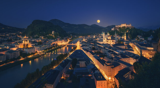 Salzsburg cityscape with illuminated buildings at night time