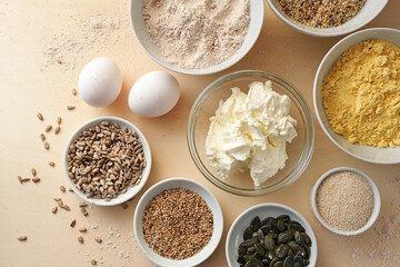Baking ingredients for a healthy protein bread with whole grain flour, seeds, curd cheese and eggs,...