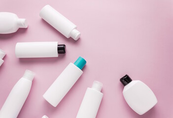 Cosmetics for body care, in plastic bottles, flat lay,top view