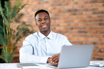 Portrait of confident successful smart handsome african american businessman, ceo or top manager,...