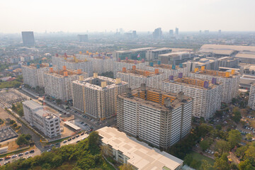 Aerial view of crowded residential apartment or condominium, Bangkok Downtown Skyline, Thailand. Financial district centers in smart urban city in Asia. Skyscraper and high-rise buildings.
