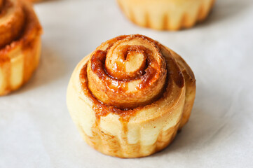 Freshly baked caramel cinnamon bun. Close up.