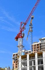 Crane and highrise construction site