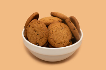 Oatmeal cookies in a white deep plate. Diet food.