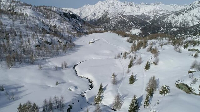 Aerial 4K, snowy landscape in Valmalenco in Campagneda area, Italy