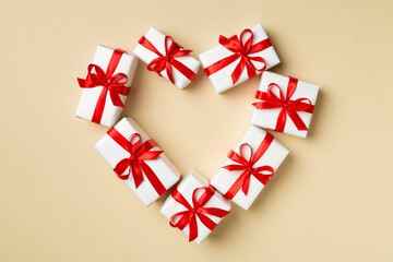 Top view of heart shaped gift boxes on color background