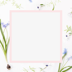 Spring frame of small flowers and daisy, floral arrangement