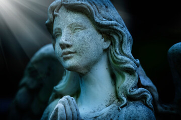 Vintage image of a sad angel on a cemetery