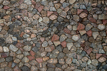 Many coloured  natural stone wall. Stone background.
