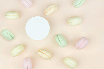 Sweet and colourful marshmallow french macaroons with round copy space. Concept of sweet dessert