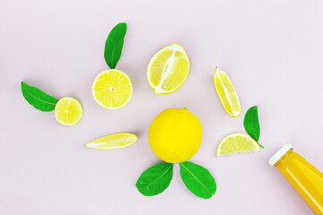 Top view lemon fruit wholeand slice splashing out from glass bottle. Flat lay image