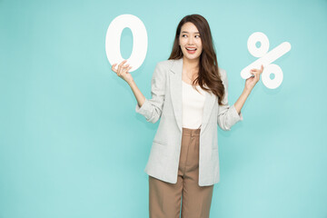 Portrait of Asian business woman standing and holding 0% number or zero percent isolated over green background