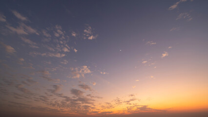 Sunset sky. Abstract nature background. Dramatic blue with orange colorful clouds in twilight time.