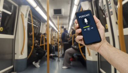 Man listening to podcast on hir phone while riding in public transport