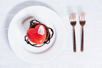 Valentine's day Heart shaped chocolate and strawberry cake. Celebration of love concept.