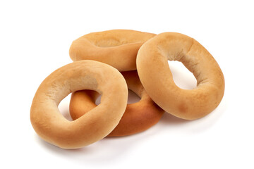 Freshly baked bagels, isolated on white background.