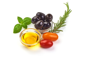 Olive oil in a bowl with tomatoes and olives, isolated on white background.