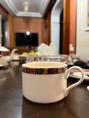 White cup at home in the kitchen 