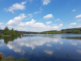 View of the first basin of the Sorpe Lake, North Rhine-Westphalia, Germany, on the left the small sail boat harbor, in the background the first dam of the reservoir