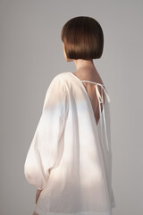 Dreamy brunette in white dress - 482434771