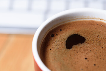 A cup of coffee on a white background. 