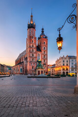 Plakat Krakow, Poland. HDR image of illuminated St. Mary's Basilica (Bazylika Mariacka) on sunrise