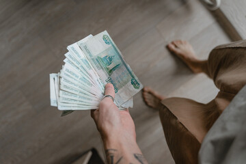 man holding paper money top view