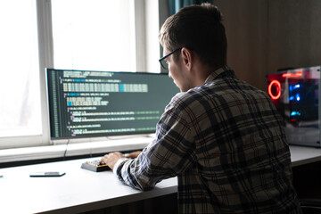 Naklejka na ściany i meble programmer developer making new code script, working on cybersecurity application