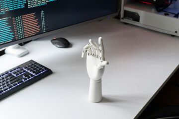 white robotic hand on the table as symbol of futuristic technology made at home
