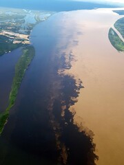 The Meeting of Waters (Portuguese: Encontro das Águas) is the confluence between the Rio Negro, a...