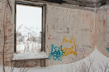 Old railway station at winter with painted walls