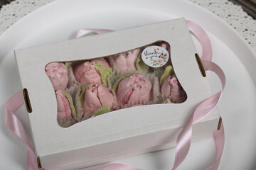 Homemade marshmallow in a gift box. Tied with a ribbon tied to a bow.