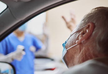 Thank you for the swift service. Shot of a senior man waving at a healthcare worker while in his...